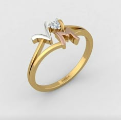 a gold ring with a diamond in the middle and two leaves on it's side