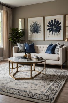 a living room filled with furniture and paintings on the wall