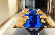 a table that is sitting in the middle of a hallway with blue paint on it