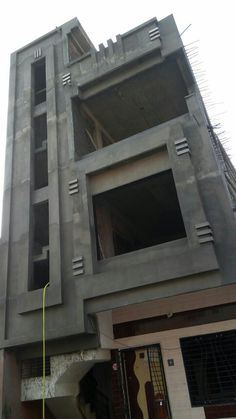 a building under construction next to a street