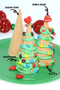 an ice cream cone christmas tree is on a green plate