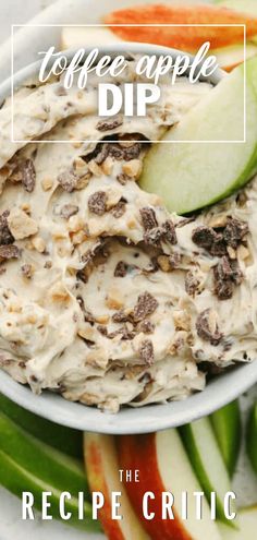 an apple dip in a white bowl surrounded by sliced apples