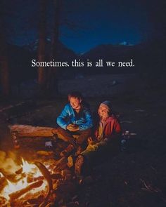 two people sitting around a campfire with a quote about having a soulmate