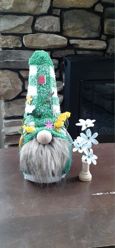 T's Famous Gnomes....  This is the Gardener Gnome, he stands 13 in. and he loves to play in the garden. he comes with his potted plant. ( of course its not  real) The Gardener, Gemstone Bracelet, Christmas Presents, Of Course, In The Garden, The Garden, Ornament Decor, To Play, Seasonal Decor