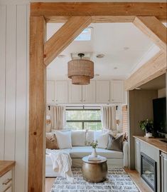 a living room filled with furniture and a fire place