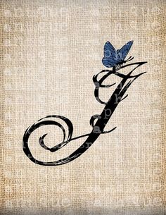 a blue butterfly sitting on top of a letter j with swirls and leaves in it