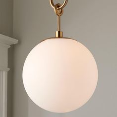 a light fixture hanging from the ceiling in a room