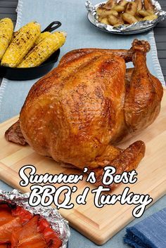 a large turkey sitting on top of a wooden cutting board next to corn and potatoes