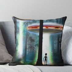 a man standing in front of a tree with an alien spaceship above him throw pillow