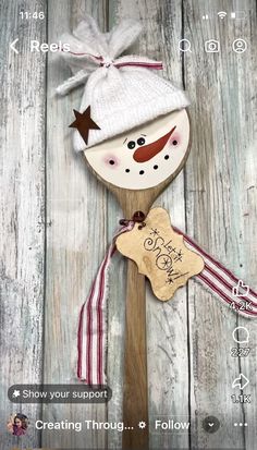 a wooden spoon with a snowman on it