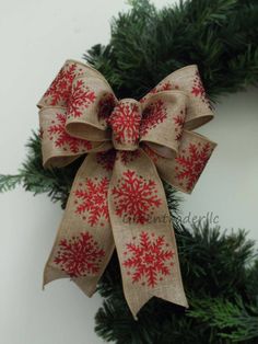 a close up of a christmas wreath with a bow