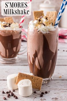 two glasses filled with chocolate milkshake and marshmallows