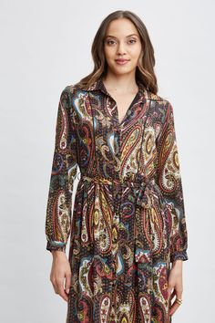 Chic & sophisticated, the metallic kissed georgette fabric give our Paisley Shirt dress an artistic edge. Designed with a self sash, tiered midi skirt & shirt collar, this paisley print long sleeve dress exudes a sense of free-spirited elegance. T-Tahari Paisley Printed Belted Long Sleeve Midi Shirt Dress 100% Metallic Polyester Runs true to Size Model is 5'9" and wearing size S Dry Clean Only Imported Style #: THF49005 Tiered Midi Skirt, Paisley Shirt, Tahari Dress, Long Sleeve Print Dress, Georgette Fabric, Midi Shirt Dress, Long Sleeve Short Dress, Long Sleeve Midi, Free Spirited