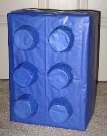 a blue plastic bag with four circles on the top and bottom, sitting in front of a door