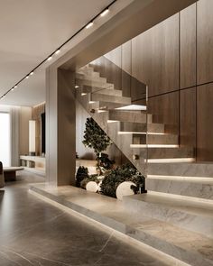 an elegant staircase with marble steps leading up to the second floor