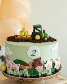 a birthday cake with farm animals on it