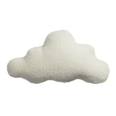 a white cloud shaped pillow sitting on top of a table