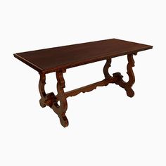 an old wooden table on a white background with no one around it to see the image