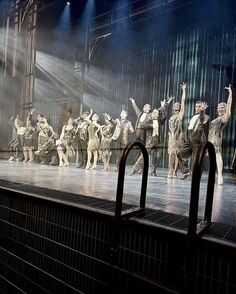 a group of people standing on top of a stage