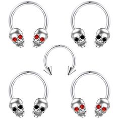 four pairs of skull nose rings with red crystal stones in the middle and two skulls on each