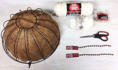 the supplies needed to make this craft include yarn, twine, scissors and coconut shell