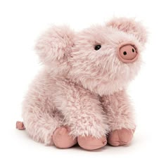 a pink stuffed pig sitting on top of a white floor