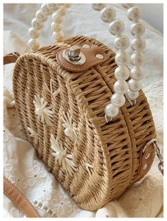 a wicker purse with pearls on it