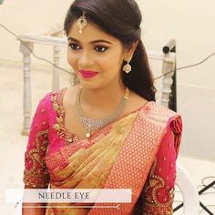 a woman in a red and gold sari