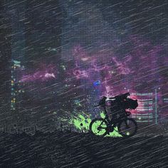 a person riding a bike in the rain