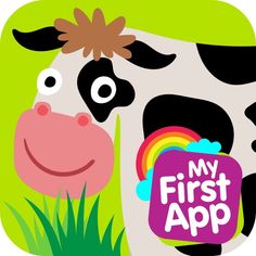 a black and white cow with a rainbow sticker on it's face in the grass