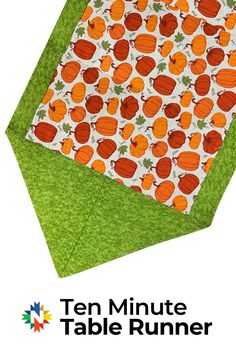 an orange and green table runner with the words ten minute table runner on it