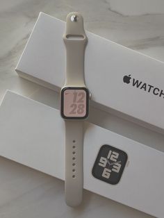 an apple watch sitting on top of a box