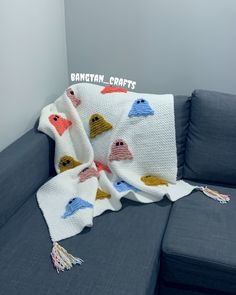 a couch with a blanket on top of it