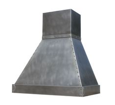 a large metal stove hood with rivets on the sides and an exhaust vent