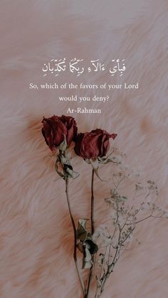 two red roses sitting next to each other on top of a fur covered ground with an islamic quote