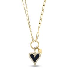 Sassy and stylish, this black onyx and diamond heart necklace from Shy Creation® is look you'll love to wear. 14K yellow gold Round diamonds halo the heart-shaped natural black onyx gemstone pendant, which is paired with a miniature polished heart pendant More round diamonds adorn the bail and chain connectors A rope-twist loop completes the glamorous style Total diamond weight is 1/8 carat 18-inch double rolo and paperclip link chain; lobster clasp Statement Heart Necklace, Ring Goals, Lucky 7, Jared The Galleria Of Jewelry, Rope Twist, Heart Necklace Diamond, Jewelry Accessories Ideas, Glamorous Style, Onyx Gemstone