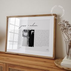 a wooden shelf with a framed photo and flowers