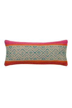 an orange, blue and pink pillow on a white background with a red stripe down the middle