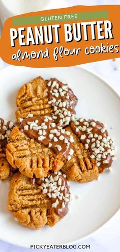 peanut butter almond flour cookies on a white plate with text overlay that reads, gluten free peanut butter almond flour cookies