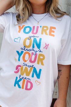 You're On Your Own Kid Tee Playful Letter Print T-shirt, School Spirit Graphic Print Tops For Spring, Spring Graphic Print Top For School Spirit, Cute Graphic Print White Top, Fun White Printed Tops, Cute White Graphic Print Top, School Spirit Cotton Tops With Graphic Print, Summer Cotton Tops With School Spirit, Cotton Tops With Graphic Print For School Spirit