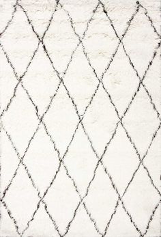 a white rug with black lines on the bottom and one diagonal diamond pattern in the middle