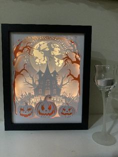 "“Haunted House” lighted shadow box. So much beauty in this piece, the piece comes alive when the lights are turned on! �� All my frames are hand constructed. I use shadow boxes to hold the layers of 80 pound card stock paper and led lights. I carefully apply the lights so the pictures are lit clearly for the best effects. The frame comes in sizes; 5\" x 7\" or 8” X 10”. Each box includes battery operated lights. Battery type are CR2032 (common car remote/watch battery). Each box turns on and of Light Up Shadow Box Svg, 3d Shadow Box With Lights, Shadow Box Art Night Lights, 3d Lighted Shadow Box, Cricut Shadow Box With Lights, Cricut Light Box, Cricut Picture Frames, Lighted Shadow Box, Halloween Shadow