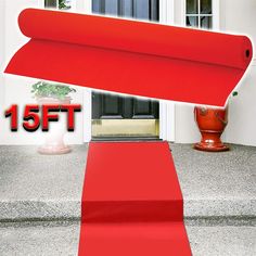 a red carpeted entrance way leading to a house