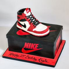 a pair of sneakers is on top of a birthday card box that says happy 35th birthday krisa