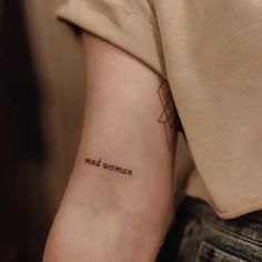 small minimalist folklore inspired Taylor Swift tattoo ideas with script that says "mad woman" Evermore Tattoo, Taylor Swift Tattoo Ideas, Swift Tattoo, Instagram Taylor Swift, Back Of Arm Tattoo, Mad Woman, Taylor Swift Tattoo, Lyric Tattoos, Amazing Tattoos