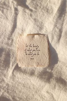 a piece of paper with an inscription on it that reads let the beauty of what you love be