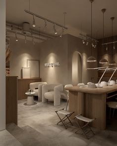 the interior of a nail salon with chairs and tables