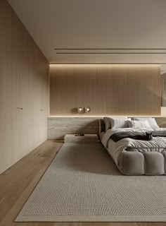 a large bed sitting on top of a wooden floor