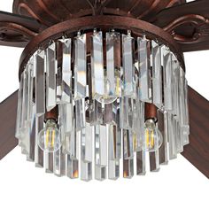 a chandelier hanging from a ceiling fixture with crystal beads and wood trimmings