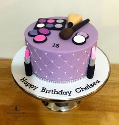 a birthday cake with makeup and lipstick on it